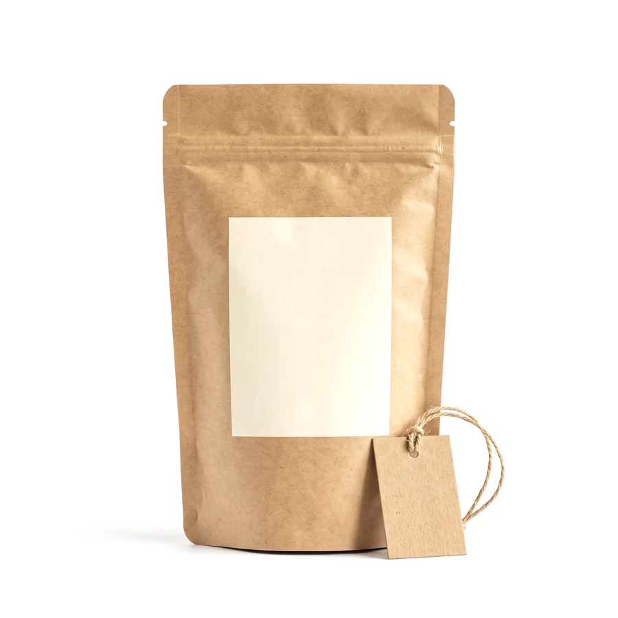 A plain kraft pouch with a blank label panel and a blank kraft tag